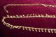 Bauchkette aus goldfarbenem Metall mit Glöckchen
